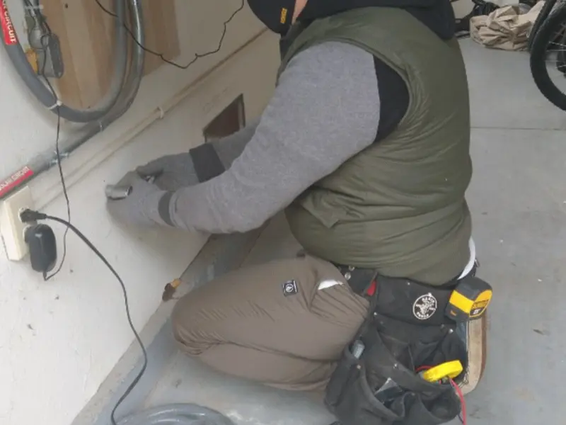 Electrician performing outlet wiring in a Soquel garage